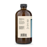 Dr. Mercola MCT Oil vertido en vaso para preparación rápida y energía inmediata