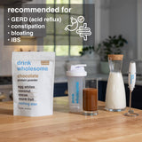 drink wholesome vaso con batido de chocolate listo, beneficio de digestión suave