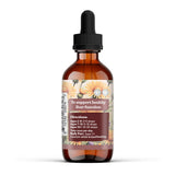 Raíz de diente de león y cúrcuma secos junto a botella Earthley Wellness apoyando limpieza