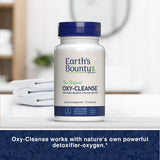 Earth's Bounty frasco junto a ingredientes representativos para contexto natural