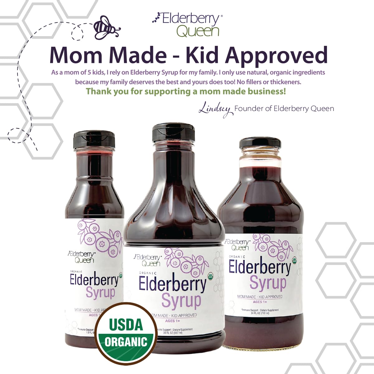 Elderberry Queen botella al lado de frutas para escala, muestra tamaño real
