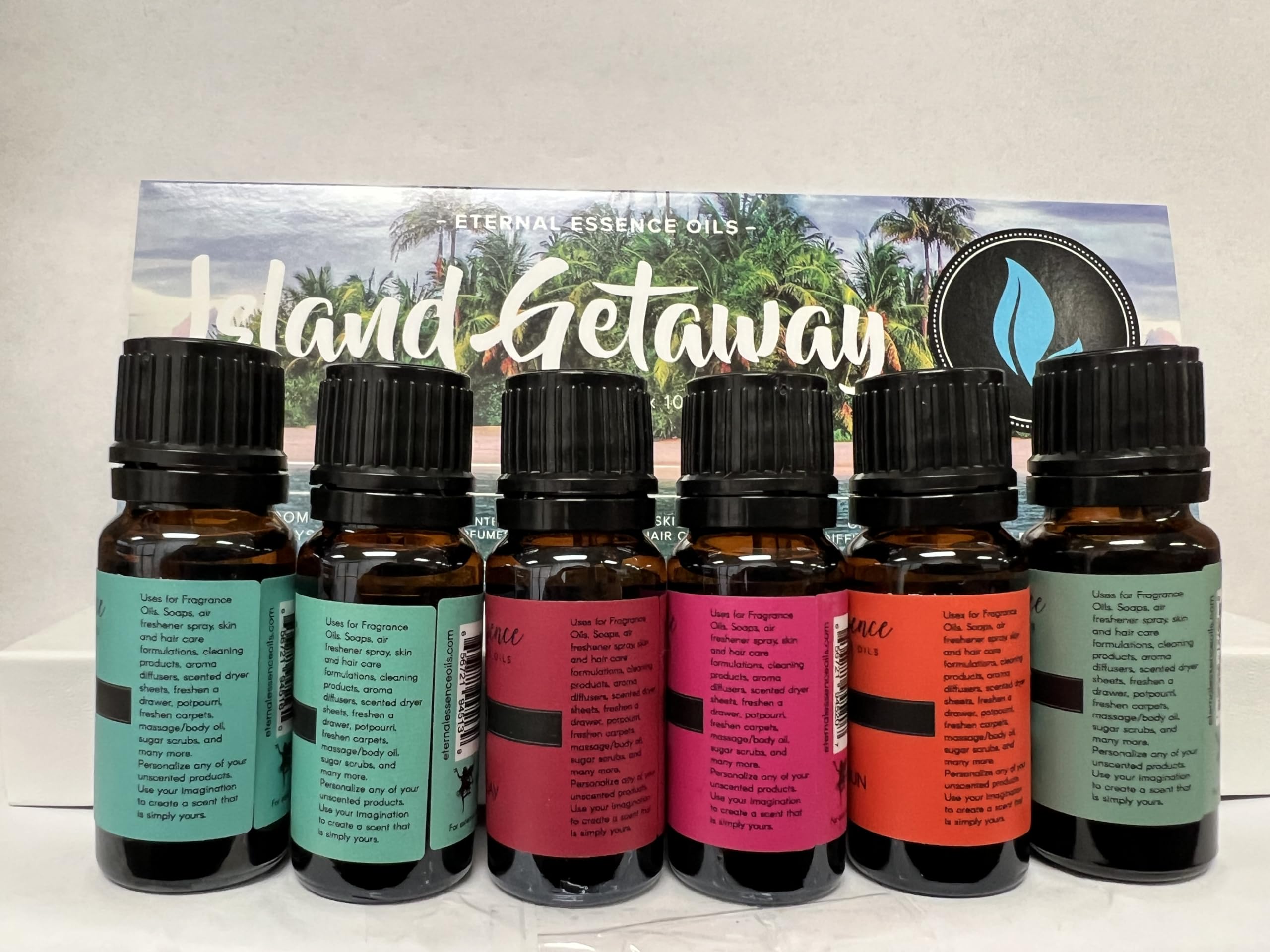 Eternal Essence Oils botellas junto a velas artesanales mostrando aplicación creativa