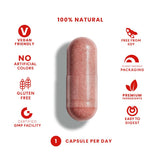 Botella abierta con cápsulas FeelGood Superfoods lista para tomar