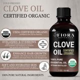 Fiora Naturals gota de aceite de clavo sobre dedo, detalle de textura y concentración