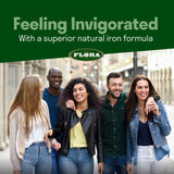 Flora Flor‑Essence comparación de escala junto a una taza para referencia de tamaño