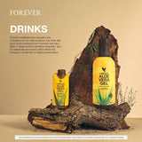 Escena de cocina con botella Forever Living aloe y frutas, integración fácil en recetas