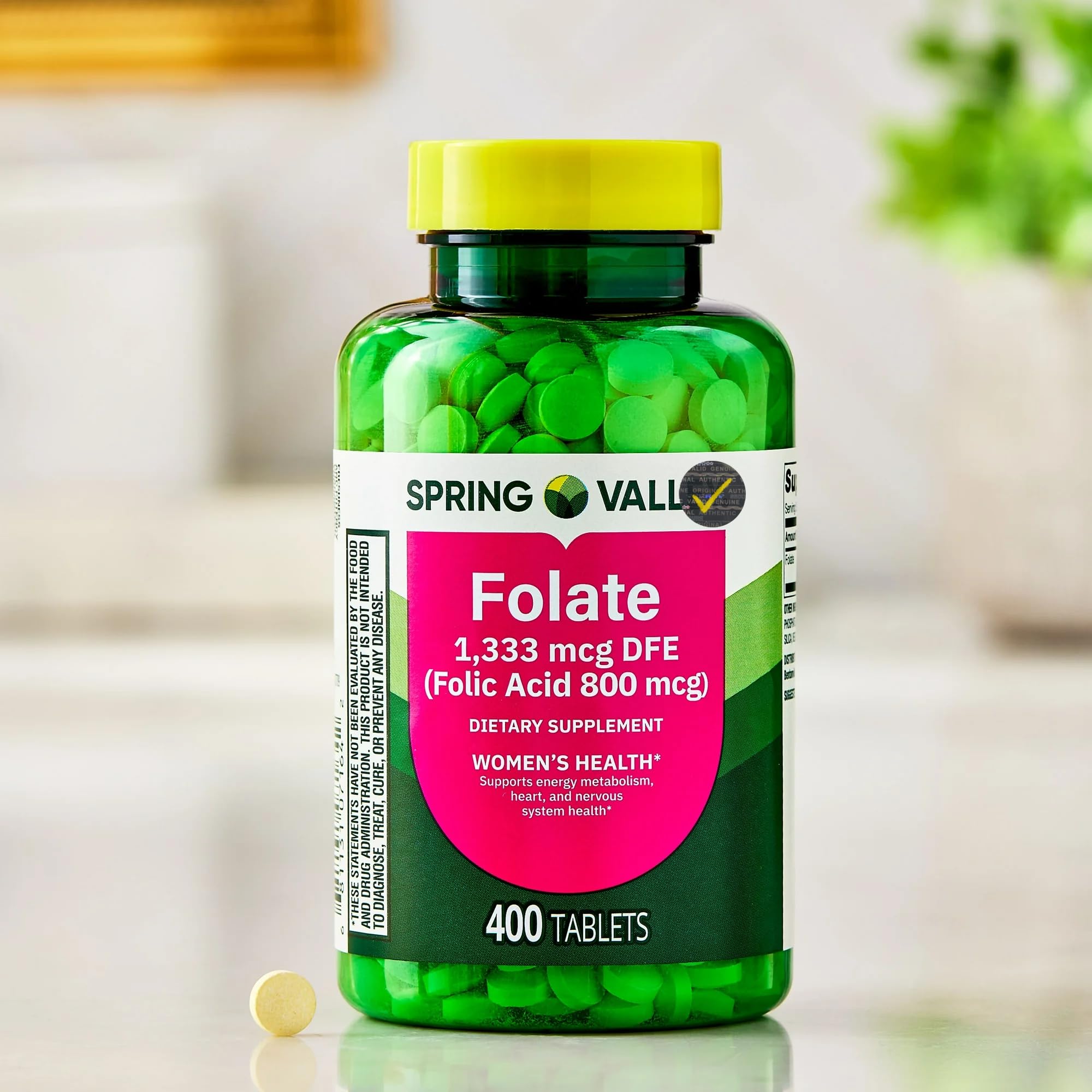 Generic frasco abierto con tabletas Folate visible, beneficio de suministro prolongado