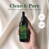 Global Healing tamaño en mano para comparar volumen de 2 fl oz