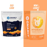 Gnarly Nutrition polvo naranja piña textura cercana, mezcla rápida