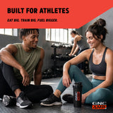 GNC AMP MASS XXX comparación de tamaño del envase en manos para ver escala y rendimiento