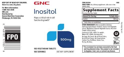 GNC tableta de inositol en primer plano, textura uniforme y vegana