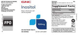 GNC tableta de inositol en primer plano, textura uniforme y vegana