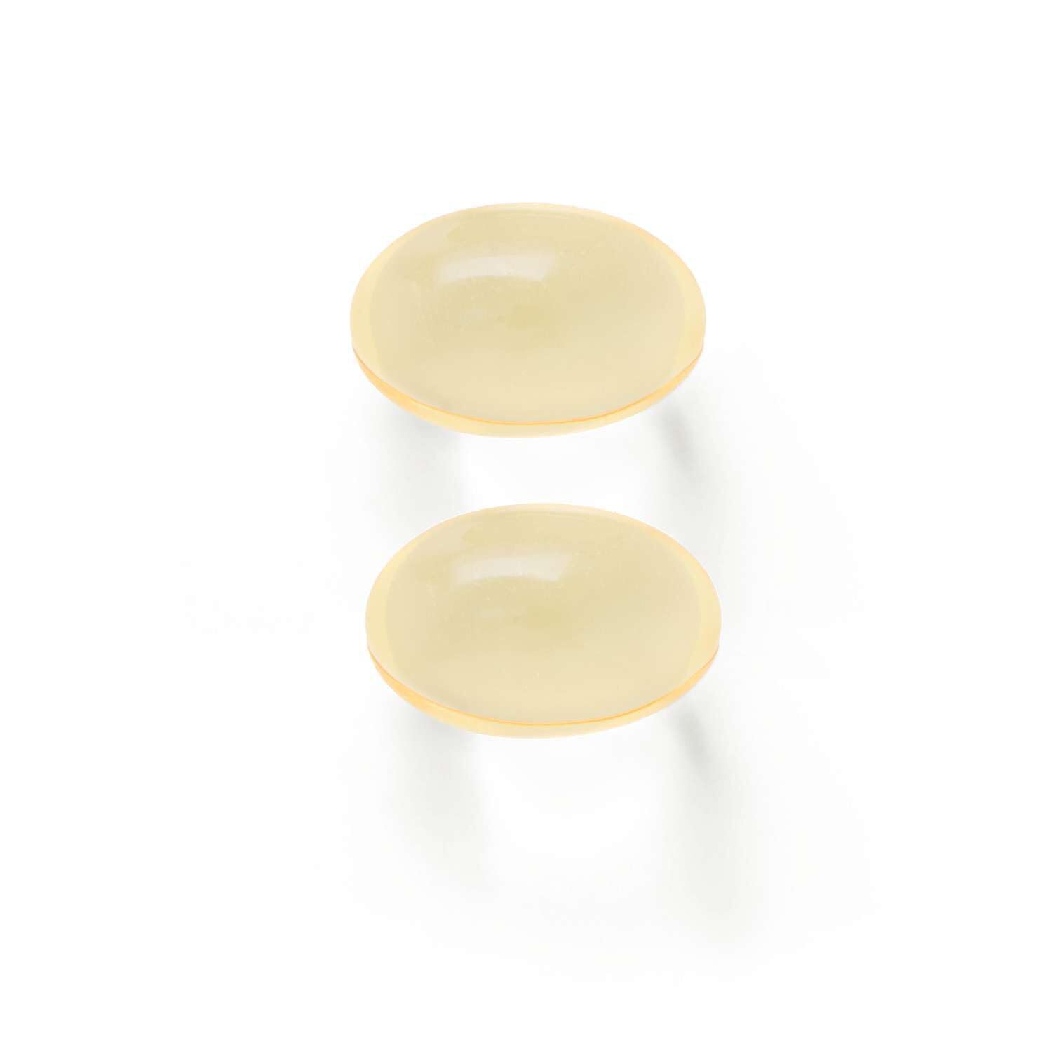 GNC cápsulas sobre fondo con limón resaltando sabor cítrico