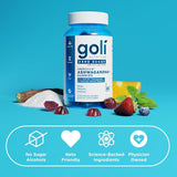 Goli comparación de tamaño junto a moneda para escala clara
