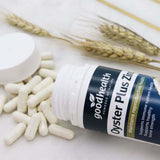Goodhealth Oyster Plus cápsula junto a moneda para comparar tamaño