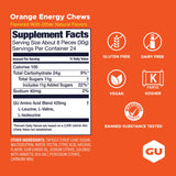 Bolsa de GU Energy Chews naranja en mano para comparar tamaño y portabilidad