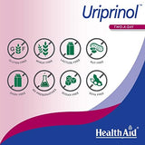 HealthAid Uriprinol tableta junto a vaso de agua demostrando facilidad de toma