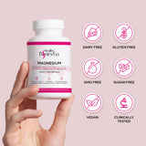 Healthy Bones Co. cápsula junto a moneda para ver tamaño real