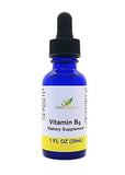 Herb-Science frasco frente en vidrio azul mostrando etiqueta legible y protección UV