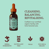 Herbs Etc. Essiac Tonic Classic 2 fl oz junto a monedas para escala, tamaño portátil