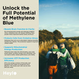 Heylo Health frasco abierto sobre escritorio junto a laptop, apoyo al enfoque durante trabajo