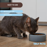 Holy Pets envase junto a objeto para comparar tamaño y cantidad
