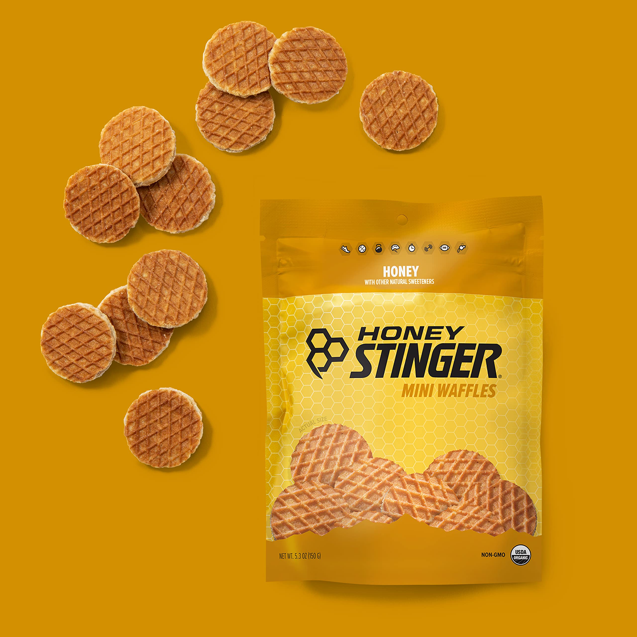 Honey Stinger mini waffles en un bol junto a ropa de gimnasio lista para entreno