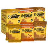 Honey Stinger empaque frontal del surtido mostrando variedad y portabilidad