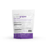 HumanN frasco SuperGrapes en mesa con frutas estilo de vida saludable