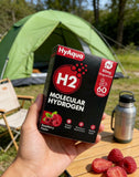 HyAqua tabletas sabor frambuesa en mano mostrando presentación y aroma