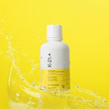 Immunotec K-21+ comparación de tamaño de la botella en mano