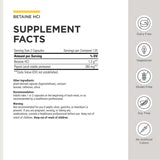Integrative Therapeutics cápsula en mano para referencia de tamaño