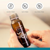 Isagenix Collagen Elixir en mano demostrando portabilidad y conveniencia