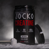 Jocko Fuel mezclado en vaso, disolución clara para consumo inmediato después de entrenar