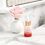 Joylux revitalizHER en baño lifestyle mostrando uso cotidiano y discreción en el tocador