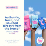 JoySpring LingoLeap botella colocada sobre una mesa junto a un gotero y vaso