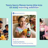 JoySpring gotas dosificadas en jugo ilustrando mezcla suave y sabor berry