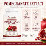 KYZTMHC frasco junto a granadas frescas en entorno natural sugiriendo pureza orgánica