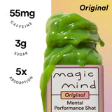 Magic Mind shot en mano listo para beber, energía enfocada al instante