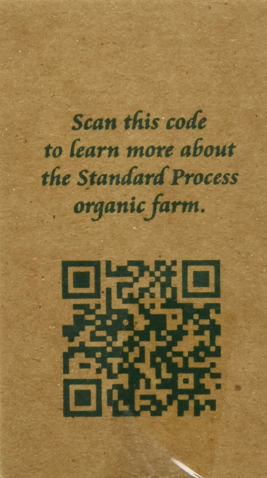 Standard Process Inc. tabletas en mano para comparar tamaño y facilidad de toma