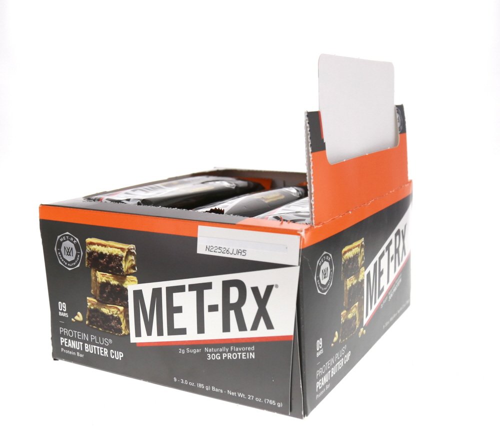 MET-Rx etiqueta nutricional en primer plano indicando vitaminas y azúcares bajos