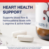 Metagenics Arginine Plus tableta en mano para comparar tamaño y dosificación
