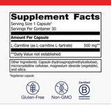 Metagenics L-Carnitine cápsula en mano para comparar tamaño y dosificación