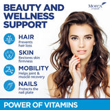 MOREX VITAMINS gomita en mano para comparar tamaño y facilidad de uso