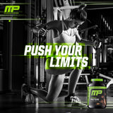 MusclePharm tarro al lado de una cinta métrica para escala de 4.2 lb