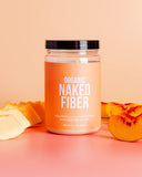 NAKED Fiber frasco junto a regla para comparación de tamaño y uso diario