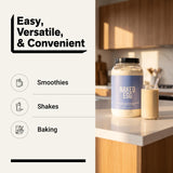 NAKED envase junto a frutas para comparar tamaño y porciones