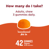Nature Made gomitas en mano para comparar tamaño y porción