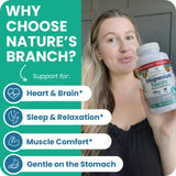 Nature's Branch cápsula en mano para comparar tamaño y facilidad de uso