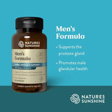 Frasco Nature's Sunshine junto a una regla para comparar tamaño y porciones
